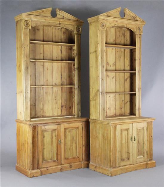 A near pair of classical style pine open bookcases, W.3ft 2.5in. D.1ft 10in. H.8ft 7in.